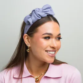 Liliowa lniana sztywna opaska z kokardką.